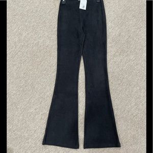 Sexy faux Suede flair legged pants in black size M. Flattering ! NWT